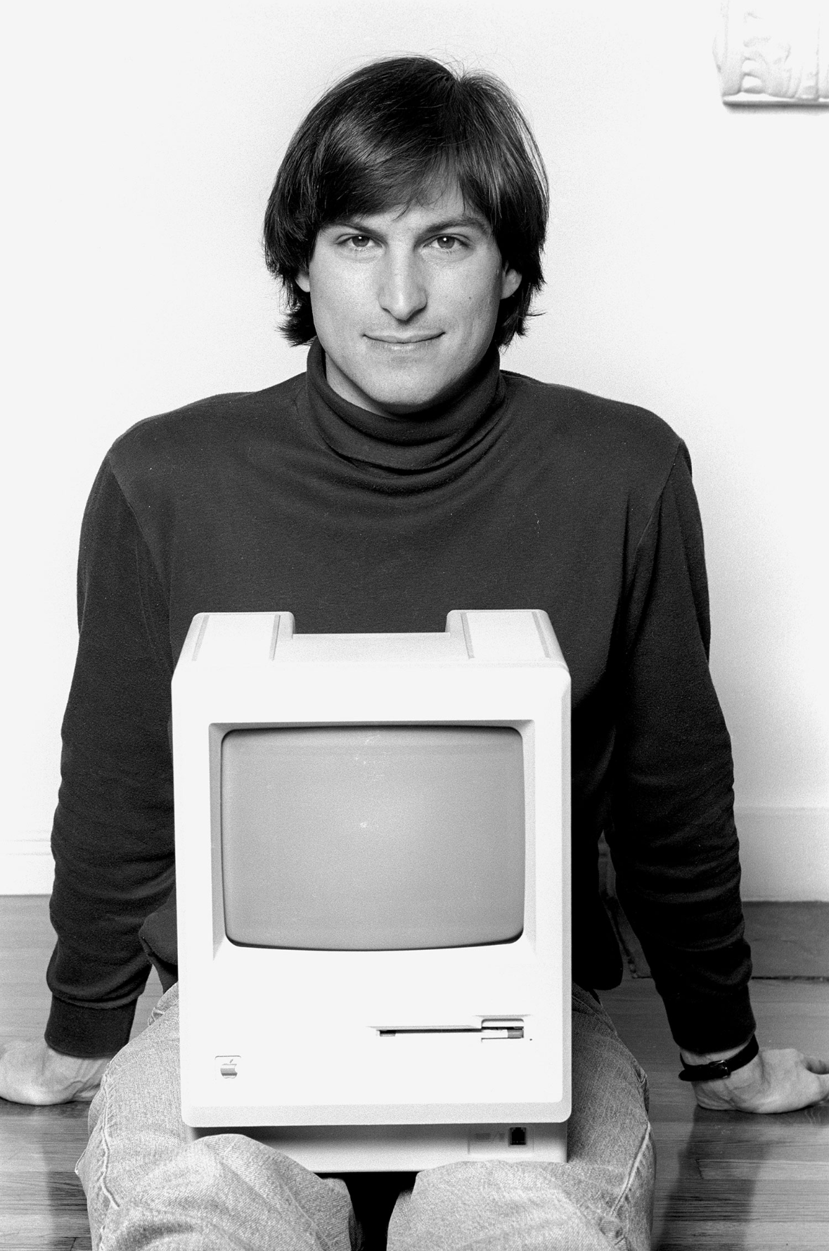 Steve Jobs with his computer